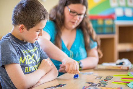 Two children playing a board game