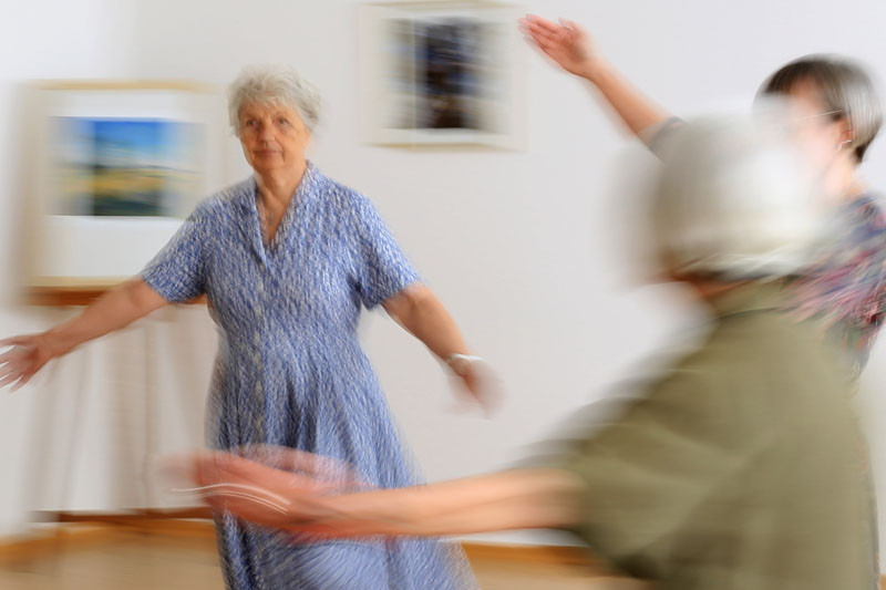 Three older women dancing