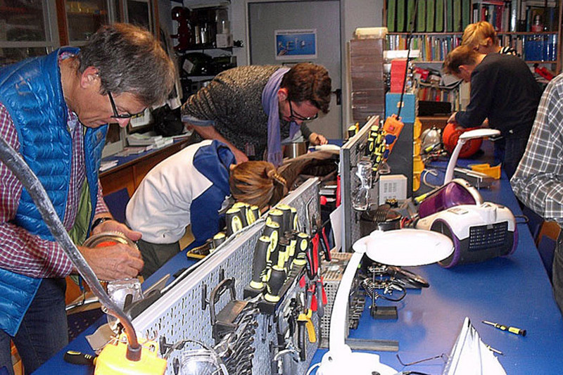 Workspace where adults and pupils are repairing things