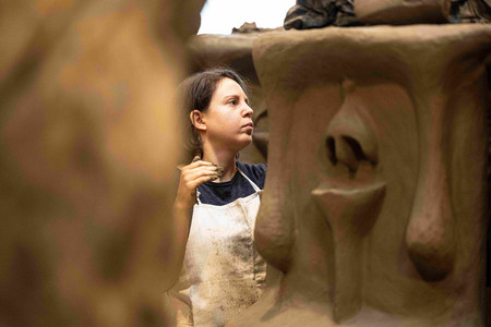 Female student sculpting