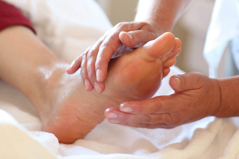 Nurse rubs feet