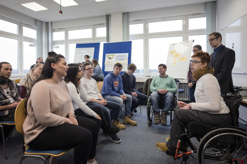 The educational specialists with students at a seminar