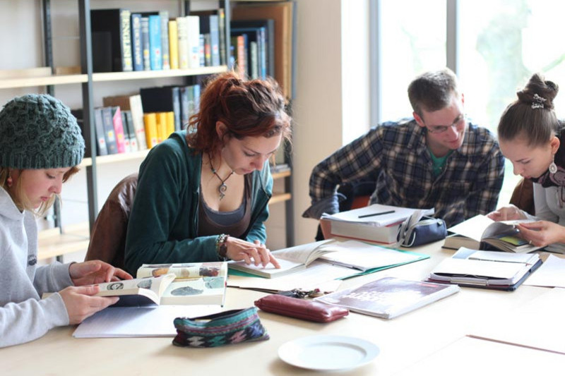 Students reading at the graduate training institute