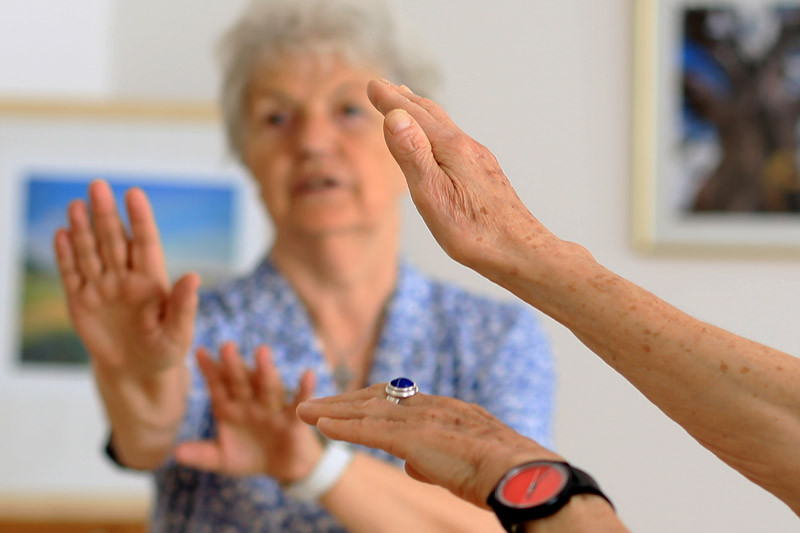 Old women doing some movement exercises