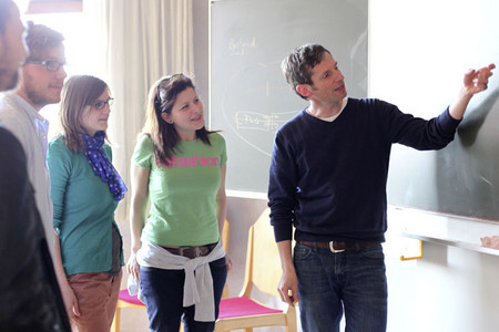 Students and their lecturer in an auditorium