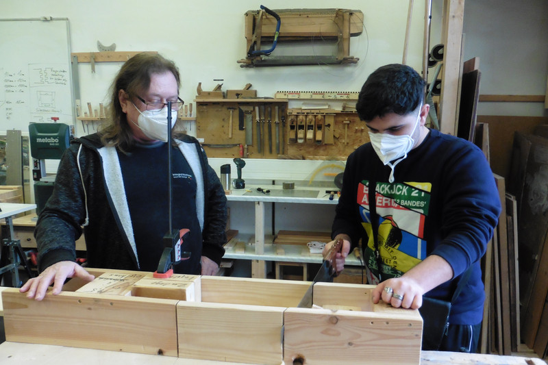 Trainee with an instructor in the wood workshop